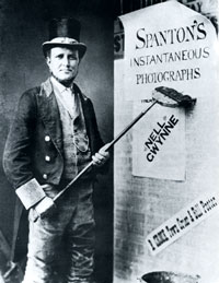 Mr Crook was the Town Cryer in 1898 in Bury St Edmunds. His work seems to have included posting bills on behalf of local businesses. Spanton took this photograph for mutual publicity.